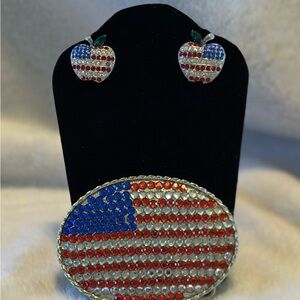 Belt buckle with matching earrings.